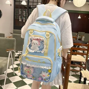 Cute light blue ita backpack with lace trim, transparent display window, and large capacity.