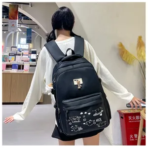 Casual black school backpack with cute white graffiti and bear pendant for daily travel use.