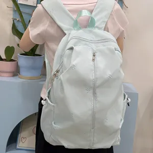 Light blue school backpack with cute bow embroidery, perfect for students and daily casual use.