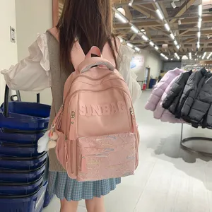 Pink large capacity student backpack, casual lightweight school bag for teen girls.