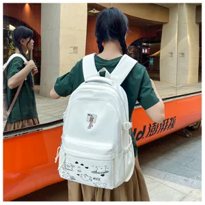Stylish white casual backpack for women, simple school bag with cute bear charm and pocket.