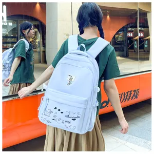 Detail shot of casual backpack showcasing cute graphic prints, spacious compartments, and comfort.