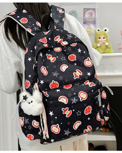 Cute black backpack with apple print and fluffy bear pendant, stylish casual school bag.