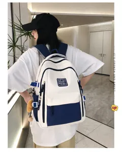 Stylish color-block canvas backpack for women, large capacity casual student school bag.