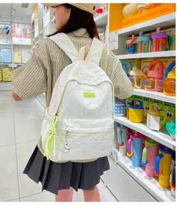 Casual white green textured women backpack with cute bear pendant and spacious capacity daily use.