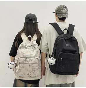 Casual bamboo print student backpack with cute panda pendant, large capacity travel school bag.