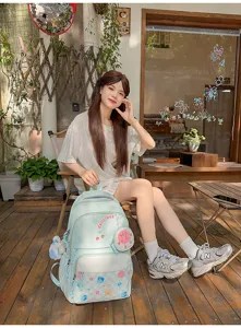 Japanese casual student backpack in mint green with cute pouch, stylish and spacious for daily use.