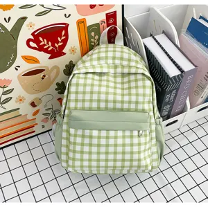 Green gingham backpack detail showing clear plaid pattern, spacious design and front zipper pocket.