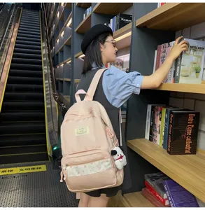 Pink floral patchwork school backpack for women, cute casual daypack for student daily commute.