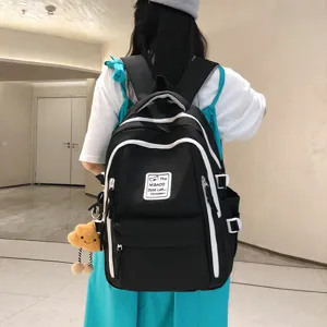 Casual black school backpack for women, stylish contrast color design, large capacity daypack.