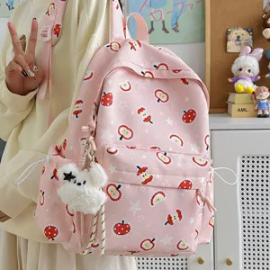 Korean style cute apple print pink backpack for women, sweet school bag with plush bear charm.