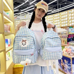 Cute blue checkered backpack for students, featuring a sweet puppy patch and large capacity.