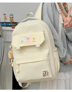 Large capacity canvas backpack for women and students, stylish daily school bag with cute designs.