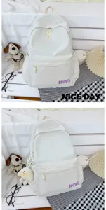 Detail view of white casual campus backpack, minimalist design with front pocket and durable fabric.