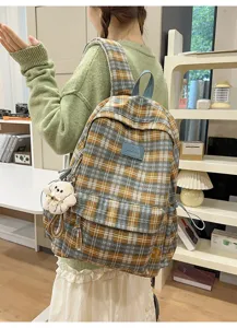 Vintage plaid backpack detail, casual school rucksack with cute bear pendant and multi-compartment.