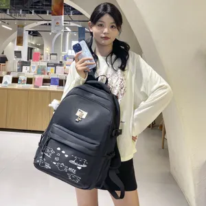 Casual minimalist backpack for teenage girls, trendy black school bag with cute bear charm.