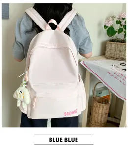 Detailed view of the pink casual backpack showing back wear style and cute pendant.