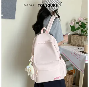 Casual pink campus school backpack for women, lightweight minimalist design for travel.