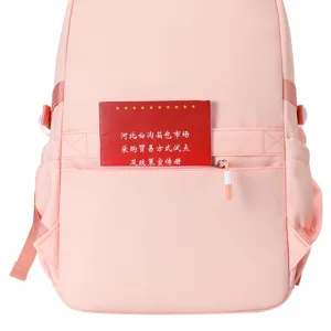 Vista dettagliata dello zaino scolastico rosa impermeabile con tasca frontale e grande capacita.