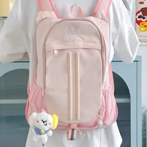 Pink college style backpack for women, cute casual daypack with large capacity and plush bag.