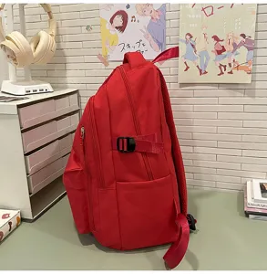 Sac à dos style collège rouge décontracté simple léger trajet polyvalent grande capacité.