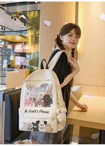 Cute canvas backpack for students, large capacity cartoon animal doodle school bag style.