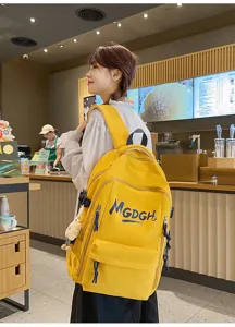 Casual yellow canvas backpack, large capacity minimalist double shoulder bag for daily use.
