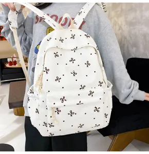 Cute bow print canvas backpack, light casual school bag for students, large capacity stylish daypack.