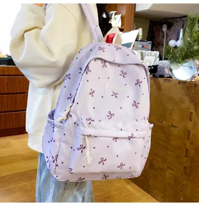 Light purple casual backpack with cute bow and polka dot print for daily school travel