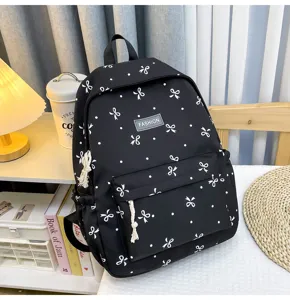 Casual black backpack with cute white bows and dots, large capacity school bag for daily use.
