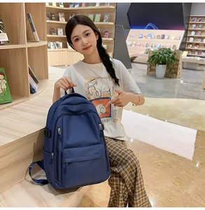 Sac à dos style collège minimaliste pour étudiants, grande capacité, léger et pratique.