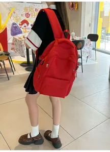 Sac a dos casual rouge vif de grande capacite pour l ecole et les deplacements.