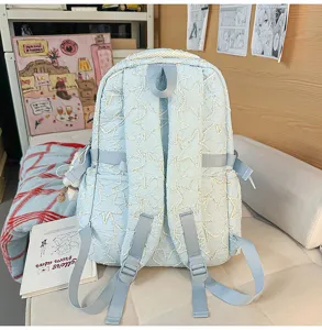 Light blue quilted star school backpack, large durable student laptop rucksack for daily commute.