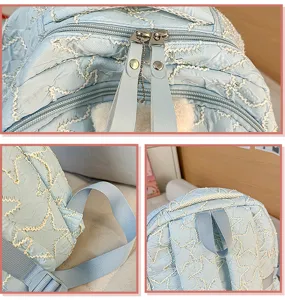 Lightweight light blue casual school backpack detail view featuring star embroidery and dual zippers.