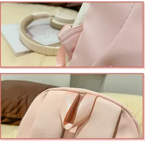 Pink backpack detail shot showing handle and strap stitching, cute and durable material.