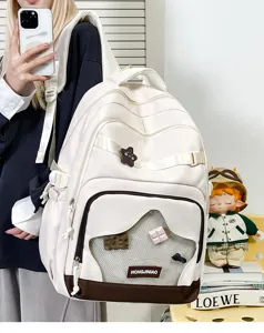 Bellissimo zaino scolastico bianco e marrone di grande capacità con tasca a rete frontale.