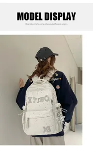 This detailed view showcases the spacious canvas school backpack with cute star patterns.