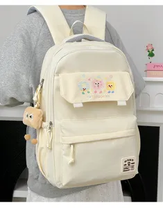 Detailed view of large capacity beige school backpack with cute cookie print and daily style.
