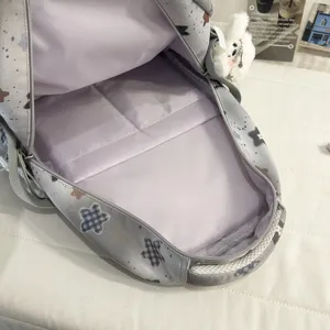 Grey star printed casual backpack school bag for students with multiple inner compartments.