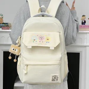 Large capacity school backpack for women and girls, stylish campus daypack with cute cookie prints.