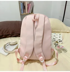 Pink cute student school bag detail view, casual backpack with adjustable shoulder straps.