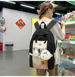 Japanese style cute black and white ita backpack with transparent front window and pendants.