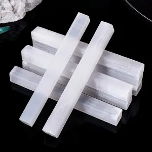 Natural white selenite crystal sticks raw mineral specimens for healing and home decor display.