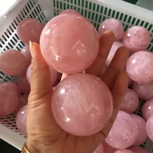 Natural rose quartz crystal ball for home decor, polished gemstone sphere healing.