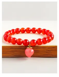 Red agate bead bracelet with pink peach pendant, natural gemstone jewelry for women and girls.