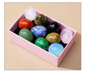 Natural crystal stone egg set in gift box, polished gemstone decor for home display.