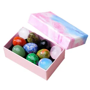 Natural crystal gemstone eggs set in gift box, colorful mineral stones for home decor.