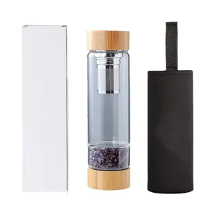 Natural crystal glass water bottle with bamboo lid, stainless steel infuser and protective sleeve.