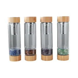 Natural crystal gravel glass water bottle with bamboo lid and stainless steel infuser.