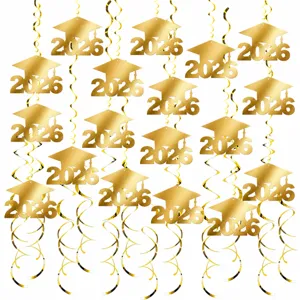 Close-up view details of gold 2026 graduation hanging swirls and ceiling decoration.